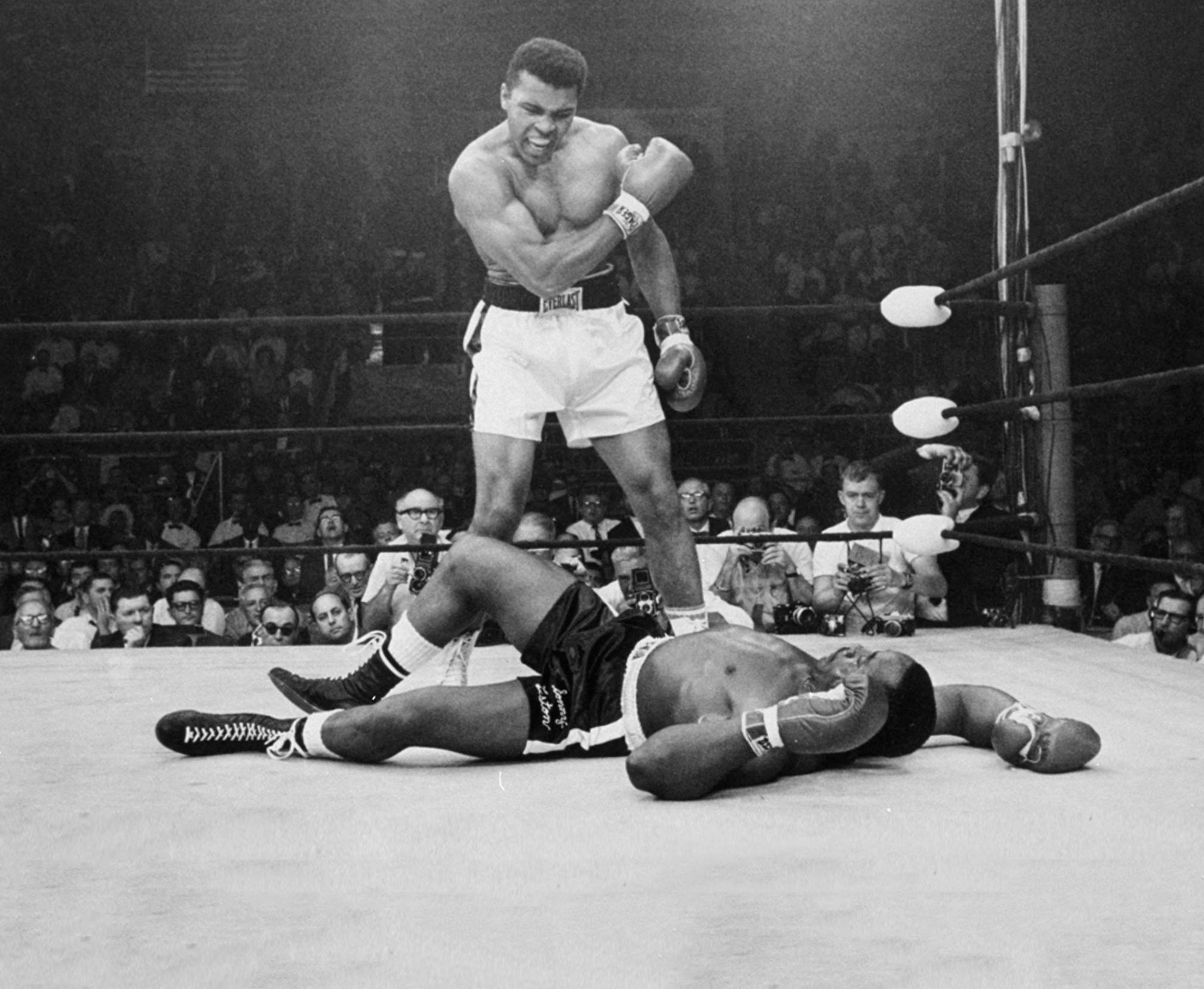 Muhammad Ali standing over a fallen Sonny Liston